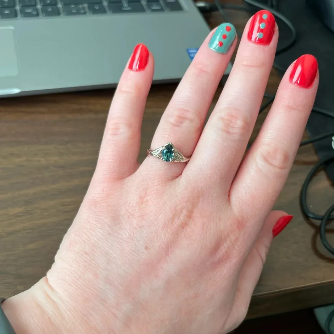 /public/photos/live/Petite Twist Pear Cut Green Moissanite Ring 483 (3).webp